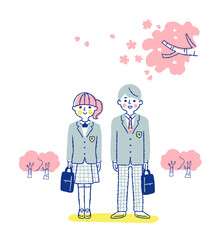 高校生の男女と桜