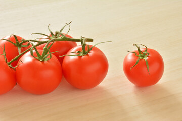 Tomatos on a wood table
