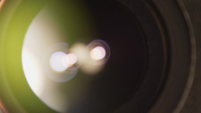 Front detail of camera lens iris blades smoothly opening