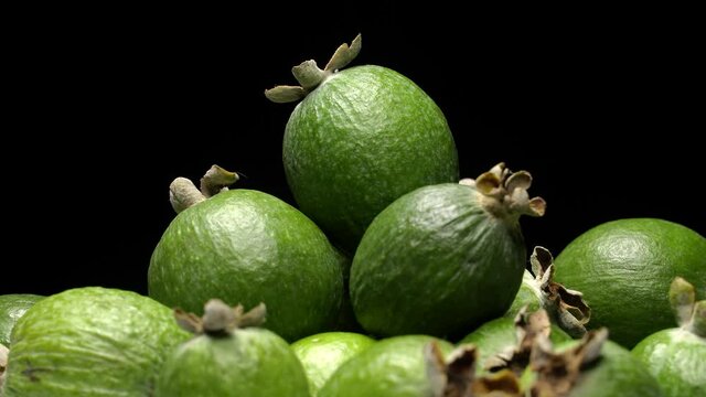 Acca sellowiana fruit (feijoa) rotation background. Close up
