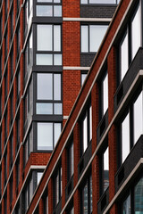 Obraz premium Tall skyscraper buildings of Manhattan, New York. Close up and detail view of the architecture of these modern buildings.