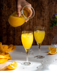 Orange juice pour droplets