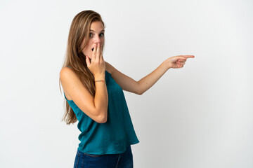 Young caucasian woman over isolated background with surprise expression while pointing side