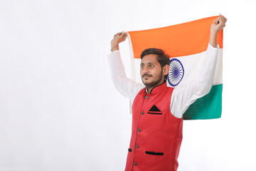 Young indian man with indian flag on white background.