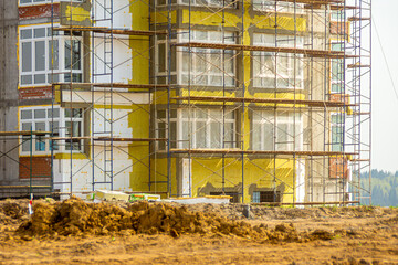 wall insulation of a multi-storey residential building using expanded polystyrene and mineral insulation plates