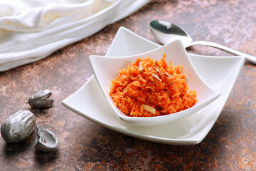 Indian Food Gajar ka Halwa (Carrot Sweet Pudding)  in a white Bowl