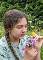 girl and a small bouquet of flowers..