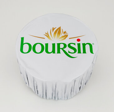 Boursin garlic and herb full fat soft creamy cheese wrapped in foil packaging