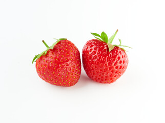 Two strawberries on white background