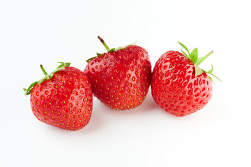 three strawberries isolated on white background