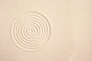Fototapeta na wymiar A circle in the sand. Zen Japanese garden. Background.