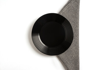 Empty plate on withe background table and grey napkin. Food background for menu, recipe. Flat Lay, top view for Table setting. Mockup for restaurant dish.	