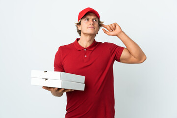 pizza delivery man over isolated white background having doubts and thinking