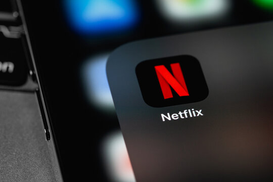 Netflix icon mobile app on screen smartphone iPhone closeup. Netflix is an international leading subscription service for watching TV episodes and movies. Moscow, Russia - November 11, 2021