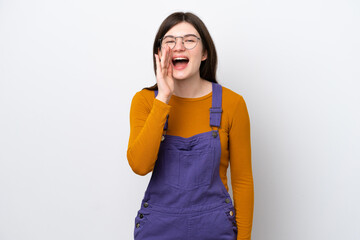 Young Russian woman isolated on blue background shouting with mouth wide open