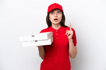 Young Russian pizza delivery picking up pizza boxes isolated on white background thinking an idea...