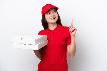 Young Russian pizza delivery picking up pizza boxes isolated on white background pointing up a...