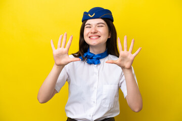 Airplane stewardess Russian woman isolated on yellow background counting ten with fingers