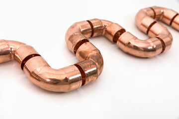 Obraz premium Group of fittings on a white background. Copper fittings for pipe connections. Technical basis for heating companies.
