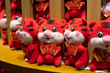 Beijing - Jan15, 2022: Chinese Year of Tiger arrives, supermarkets are attracting customers with plush toys featuring cartoon characters and accessories, "mascots" featuring tigers are selling well
