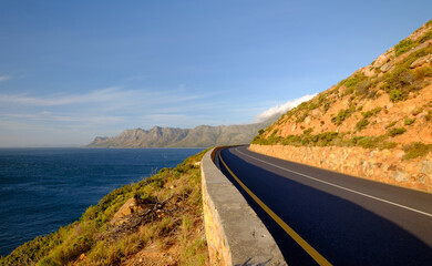 Beautiful coastal view of False bay and the Hottentots Holland mountains along the Clarence drive between Gordons Bay and Rooiels in the western cape, near Capetown in South Africa