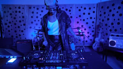 DJ playing music with mixer player in house studio - Youth musician entertainment concept