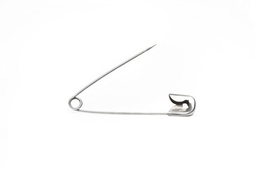 Close p opened safety pin on white background
