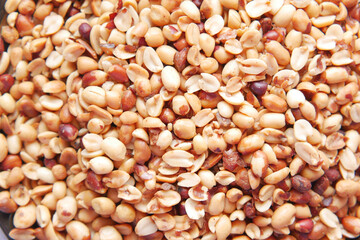Processed pea nuts in a bowl on table top down .
