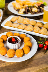 Colorful Food Appetizer Starts Snacks Fresh Delicious Menu Recipe Meal Meat Chicken Fries Fish Seafood Beer on a wooden table