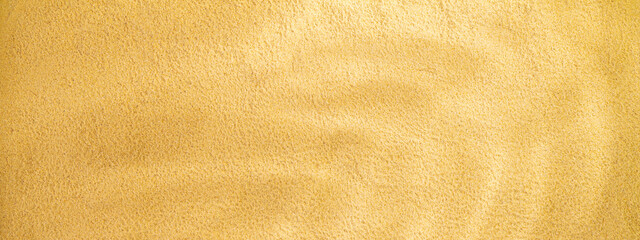 Sand background with copy space for text, banner. Sand texture closeup with palm shadow. Horizontal background pattern of sand beach