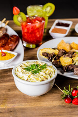 Colorful Food Appetizer Starts Snacks Fresh Delicious Menu Recipe Meal Meat Chicken Fries Fish Seafood Beer on a wooden table