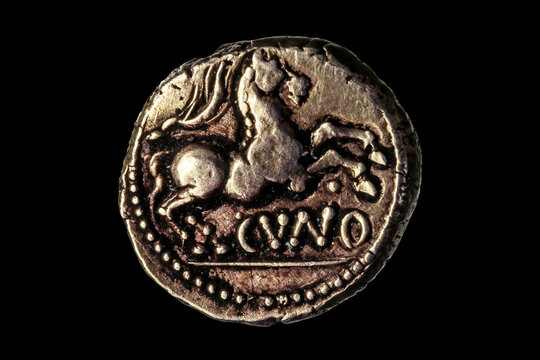 British Gold Stater Coin Of The Iron Age Catuvellauni Tribe Showing A Horse From The Essendon Treasure Hoard At The Time Of The Roman Invasion Of Britain, Cut Out And Isolated On A Black Background