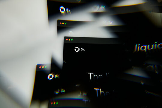 Milan, Italy - January 11, 2022: 0x - ZRX logo on laptop screen seen through an optical prism. Dynamic and unique image form 0x, ZRX coin website. Illustrative editorial.