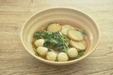 boiled fish ball and line slice with bean sprout soup on bowl
