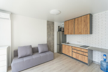 Interior of small modern apartment with white wall