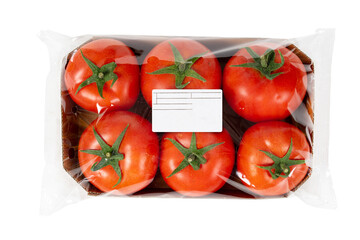 Packed and labeled fresh tomatoes on isolated white background