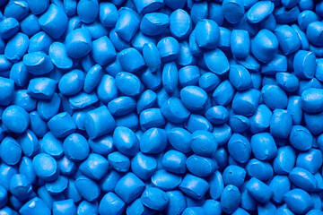 Blue polymer dye in granules, background texture