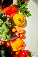Top view assorted fresh organic vegetables on table in the kitchen in sunlight, grocery healthy shopping, vegan foodб flat lay, copy space. Layout with free text