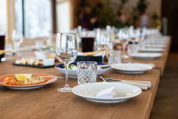 delicious dishes on the table in the restaurant. serving table. sharpness on glasses