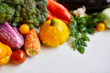 Top view assorted fresh organic vegetables on table in the kitchen in sunlight, grocery healthy shopping, vegan foodб flat lay, copy space. Layout with free text