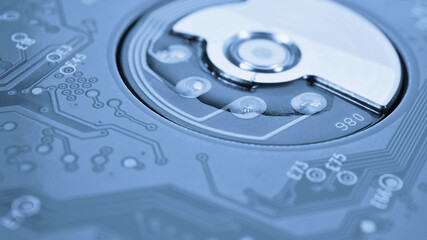 Printed circuit board PCB hard drive. Fragment of printed wiring board PWB closeup. Conductive...