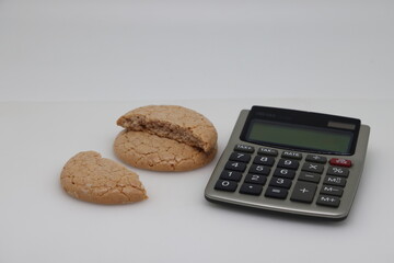 Nut cookies on electronic kitchen scales, accurate calorie counting, proper nutrition.