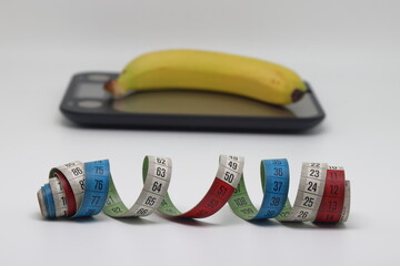 photo of the banana at electronic scales against the white background.