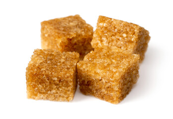 Brown sugar cubes isolated on white background