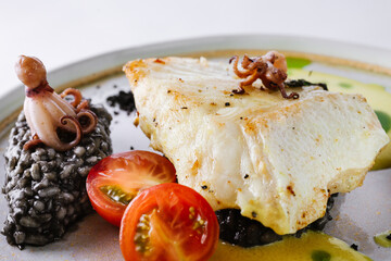 Halibut with black risotto and octopus