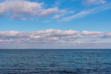 Naklejka na ściany i meble Photo of a cloudy blue sky under the sea