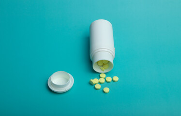 lot of medicine pills on blue background