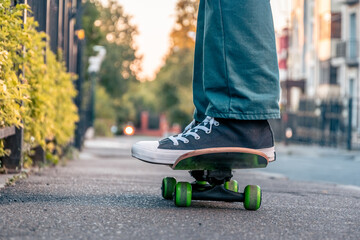 Legs of a man on a skateboard on the street © Alex Images