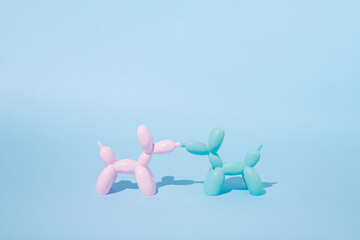 Balloon dogs in love on pastel blue background. Love card. Layout. Flat design. Minimal valentines mood. Valentine day inspiration. Love at first sight. Couple.