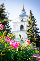 Church of St. George in Vydubitsky Monastery in the city of Kiev. Flowerbeds and trees in the courtyard of the monastery of the forest in the botanic garden.